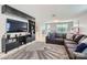 Spacious living room featuring comfortable seating, neutral carpet, and built in storage at 5957 Redwood Pine Rd, Concord, NC 28027