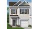 Charming two-story home with Hardie siding, an attached garage, and a covered entry at 6005 Jasmine Branch Rd, Charlotte, NC 28216