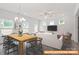 Bright, open living space featuring modern decor and a stylish dining area at 6005 Jasmine Branch Rd, Charlotte, NC 28216