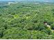Aerial view of a large property outlined, nestled within a sea of lush green trees and natural beauty at 615 Hawley Rd, McConnells, SC 29726