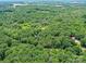 Panoramic aerial view of the expansive, tree-covered property, showcasing its natural beauty and privacy at 615 Hawley Rd, McConnells, SC 29726