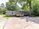 Backyard with a small deck and patio with grey siding on the home at 615 Hawley Rd, McConnells, SC 29726