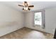 Bedroom features carpeted floors, a ceiling fan, and a window for natural light at 615 Hawley Rd, McConnells, SC 29726
