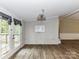 Bright dining area featuring French doors and wood-look floors at 615 Hawley Rd, McConnells, SC 29726