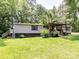Exterior shot of single story home with covered porch and manicured yard at 615 Hawley Rd, McConnells, SC 29726