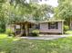 Exterior shot of single story home with covered porch and manicured yard at 615 Hawley Rd, McConnells, SC 29726