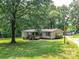 Charming single-story home with a cozy front porch and well-maintained landscaping adding to its curb appeal at 615 Hawley Rd, McConnells, SC 29726