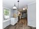 Cozy eat-in kitchen featuring wood-look floors, modern appliances, and plenty of counter space at 615 Hawley Rd, McConnells, SC 29726