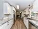 Bright, galley kitchen with stainless steel appliances and granite countertops at 615 Hawley Rd, McConnells, SC 29726