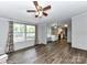 Bright living room with updated flooring and large windows, offering a welcoming space at 615 Hawley Rd, McConnells, SC 29726