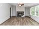 Inviting living room with a stone fireplace, neutral paint, and wood-look floors at 615 Hawley Rd, McConnells, SC 29726