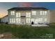 Spacious backyard with a patio and green lawn, perfect for outdoor entertaining at 6430 Stirling Ln, Indian Land, SC 29707