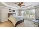Comfortable bedroom with a ceiling fan and plenty of natural light from the large windows at 6430 Stirling Ln, Indian Land, SC 29707