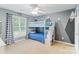 Cozy bedroom featuring a bunk bed with stairs, mountain wall art, and a basketball hoop at 6430 Stirling Ln, Indian Land, SC 29707