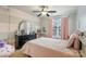 Charming bedroom featuring pink accents, a vanity, and a comfortable bed at 6430 Stirling Ln, Indian Land, SC 29707