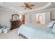 Cozy bedroom with a dresser, chair, and ensuite bathroom for added convenience and privacy at 6430 Stirling Ln, Indian Land, SC 29707