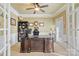 Office with french doors, tray ceiling, and a large ornate desk at 6430 Stirling Ln, Indian Land, SC 29707