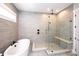 Spa-like bathroom with a freestanding tub, glass-enclosed shower, and stylish tile work at 720 Cavesson Way, Monroe, NC 28110