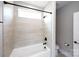 Bathroom boasts a tiled shower and tub combination with sleek fixtures at 720 Cavesson Way, Monroe, NC 28110