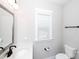 Well-lit half bathroom features sleek vanity, modern mirror, and convenient toilet at 720 Cavesson Way, Monroe, NC 28110