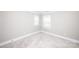 Bright, airy bedroom with neutral decor and plush carpeting at 720 Cavesson Way, Monroe, NC 28110