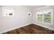 Cozy bedroom with hardwood floors and bright windows, creating a serene and inviting space at 720 Cavesson Way, Monroe, NC 28110