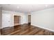 Versatile bonus room with hardwood floors and multiple doorways, offering flexible living space at 720 Cavesson Way, Monroe, NC 28110