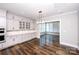 Dining room with hardwood floors, stylish lighting, and built-in cabinetry at 720 Cavesson Way, Monroe, NC 28110
