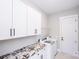 Laundry room with counter space and ample storage at 720 Cavesson Way, Monroe, NC 28110