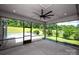 Screened-in patio with ceiling fan and views of backyard at 720 Cavesson Way, Monroe, NC 28110