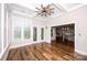 Sun room with a ceiling fan and doors leading to the backyard at 720 Cavesson Way, Monroe, NC 28110