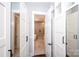 Spacious walk-in closet leading to a luxurious bathroom with a soaking tub and tiled shower at 720 Cavesson Way, Monroe, NC 28110