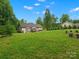 Spacious backyard with a lush green lawn and a charming gazebo for outdoor relaxation at 730 Cove Rd, Gastonia, NC 28052