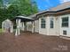 Spacious wooden deck featuring a gazebo with curtains and a greenhouse attached to the house at 730 Cove Rd, Gastonia, NC 28052