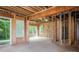 Unfinished basement with exposed beams, concrete floor, and rough wall insulation at 7703 Juniper Ln, Denver, NC 28037