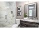 Modern bathroom with a glass shower, granite countertop, and decorative accents at 7703 Juniper Ln, Denver, NC 28037