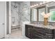 Luxury bathroom showcasing a marble shower with bench, dual shower heads, and a granite-topped vanity at 7703 Juniper Ln, Denver, NC 28037