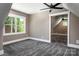 Bedroom featuring carpet, neutral paint, white trim, a ceiling fan and a bright window at 7703 Juniper Ln, Denver, NC 28037