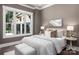 Comfortable bedroom featuring soft bedding, ample natural light, and neutral decor at 7703 Juniper Ln, Denver, NC 28037