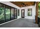 Covered back porch that is perfect for outdoor dining and entertaining at 7703 Juniper Ln, Denver, NC 28037