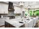 Modern kitchen with granite countertops, island seating, and top-of-the-line appliances at 7703 Juniper Ln, Denver, NC 28037