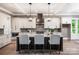 Stylish kitchen with island seating, granite countertops, and pendant lighting at 7703 Juniper Ln, Denver, NC 28037