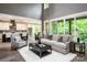 Bright living room with open layout, seamlessly connecting to the kitchen and dining area at 7703 Juniper Ln, Denver, NC 28037