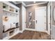 Welcoming mudroom featuring a built-in bench with storage and decorative accents at 7703 Juniper Ln, Denver, NC 28037