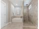 A modern bathroom features a soaking tub and separate glass-enclosed shower at 859 Academy St, Charlotte, NC 28205