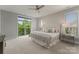 Serene bedroom featuring a luxurious bed, ample natural light, and modern furnishings, creating a peaceful retreat at 859 Academy St, Charlotte, NC 28205