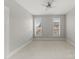 This empty bedroom has neutral paint, and large windows for natural light at 859 Academy St, Charlotte, NC 28205
