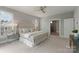 This primary bedroom features a ceiling fan, large window, and attached bathroom at 859 Academy St, Charlotte, NC 28205