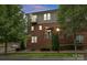 Exterior elevation of a traditional red brick multi-story townhouse at 859 Academy St, Charlotte, NC 28205