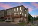 Exterior elevation of a modern multi-story townhouse with two car garage at 859 Academy St, Charlotte, NC 28205